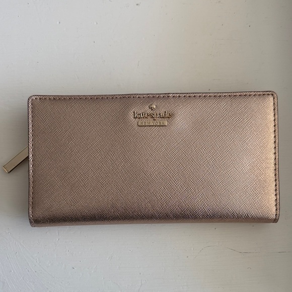 kate spade Handbags - Kate Spade Rose Gold Metallic Wallet